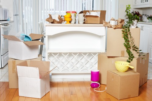 Local removals team handling furniture in a Lambeth property