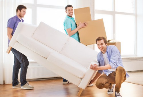 Professional movers handling a flat relocation in South London