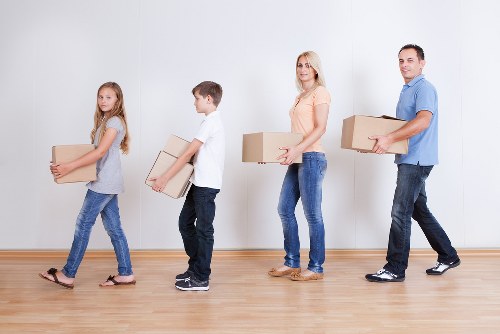 Professional house movers unloading belongings at a new Lambeth home