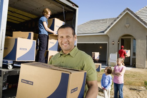 A local moving team preparing boxes for transport in Lambeth